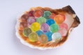 Sea shell with multicolored hydrogel balls macro Royalty Free Stock Photo