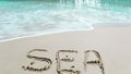 Sea shell in the sea, Ocean waves,write  SEA  I LOVE YOU on sand,beach in summer Royalty Free Stock Photo