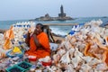 Sea shell seller with background view of Vivekananda Memorial Rock, in Kanyakumari, Tamilnadu Royalty Free Stock Photo