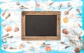 Sea shells empty blackboard blue watercolor background