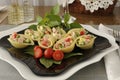 Sea shells pasta stuffed with vegetables and ham