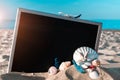 Sea shells. Starfish, seashells, toy plane and globe near blackboard on ocean nature beach. Tranquil beach scene with