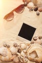 Sea shells, sunglasses and polaroid picture