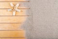 Sea shells on a wooden pier and beach sand. Empty shells of sea snails on the sand Royalty Free Stock Photo