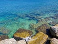 Sea shore with big stones and crear water