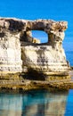 Sea shore in Cavo Greko near Aiya Napa, Cyprus. Mediterranean sea beach with lonely rock. Clear Water texture. Vertical Royalty Free Stock Photo