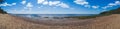 Sea shore. coastline panorama. seascape with horizon line. sky with clouds. overgrown coast