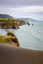 sea shore rocks and mount Taranaki, New Zealand Royalty Free Stock Photo