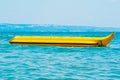 Sea shore water banana boat ride attraction Royalty Free Stock Photo