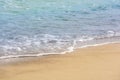Sea shore. Wave with foam. Sand on the shore. Beach. Summer rest. Calm on the sea. Resort. Tropics. Beautiful background. Place Royalty Free Stock Photo