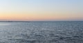 Sea shore yacht on the horizon and pier in the evening panorama Royalty Free Stock Photo