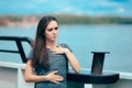 Sea sick woman suffering motion sickness while on boat Royalty Free Stock Photo