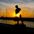 Sea side exposure of the art works of Bruno catalano on the tuscany italy. Unusual sculpture on the sunset beach