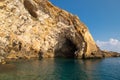 Sea side view of Siracusa coast cliffs, sandstone rocks and caves in sunny summer day. A bright colorful photo good for Royalty Free Stock Photo