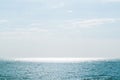 Sun glare on the water. Blue sea and sky. Royalty Free Stock Photo