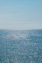 Blue sky and sea. Sun glare on the water. Marine background. Royalty Free Stock Photo