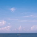 Sea sky cumulus cloud landscape view background. Calm water alone fishing boat. Destination aim progress concept Royalty Free Stock Photo