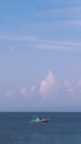 Sea sky cumulus cloud landscape view background. Calm water alone fishing boat. Destination aim progress concept Royalty Free Stock Photo