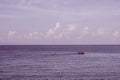 Sea sky cumulus cloud landscape view background. Calm water alone fishing boat. Destination aim progress concept Royalty Free Stock Photo