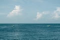 Sea sky cumulus cloud landscape view background. Calm water alone fishing boat. Destination aim progress concept Royalty Free Stock Photo