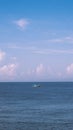 Sea sky cumulus cloud landscape view background. Calm water alone fishing boat. Destination aim progress concept Royalty Free Stock Photo