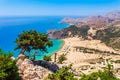 Sea skyview landscape photo Tsambika bay on Rhodes island, Dodecanese, Greece. Panorama with nice sand beach and clear blue water Royalty Free Stock Photo