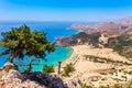 Sea skyview landscape photo Tsambika bay on Rhodes island, Dodecanese, Greece. Panorama with nice sand beach and clear blue water Royalty Free Stock Photo