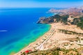 Sea skyview landscape photo Tsambika bay on Rhodes island, Dodecanese, Greece. Panorama with nice sand beach and clear blue water Royalty Free Stock Photo