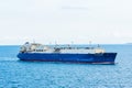 Large tanker ship, methanol carrier, sailing through blue, calm waters.