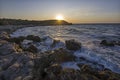 Sea spray on the rocks of the shore in the evening light of the sunset. 2 Royalty Free Stock Photo