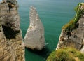 Sea Stack In The Green Shimmering Sea At The Steep Chalk Cliff Coast Of Etretat Normandy France