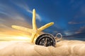 Sea star and compass in sand on sunset Royalty Free Stock Photo