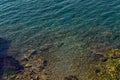 Sea with a stone bottom and a blue clear water Royalty Free Stock Photo