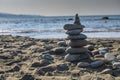 sea ??stones against the backdrop of the beach in the form of a stone tower, summer vacation 2 Royalty Free Stock Photo