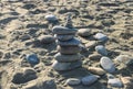 sea stones against the backdrop of the beach in the form of a stone tower, summer vacation 4 Royalty Free Stock Photo