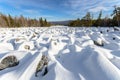 Sea of stones covered with snow, beautiful winter landscape. On the way to the mountains. Royalty Free Stock Photo