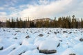 Sea of stones covered with snow, beautiful winter landscape. On the way to the mountains. Royalty Free Stock Photo