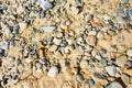Sea stones and sand beach close-up background Royalty Free Stock Photo