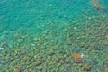 Sea stones in the sea water. Pebbles under water. The view from the top. Nautical background. Clean sea water. Transparent sea Royalty Free Stock Photo