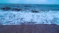 Sea storm, big waves on the sandy shore. Foam on the waves. View from the coast to the sea storm. HD video