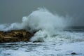 Sea storm waves crashing and splashing against jetty