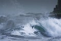 Sea storm waves dramatically crashing and splashing against rocks Royalty Free Stock Photo