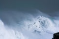 Sea storm waves dramatically crashing and splashing against rocks