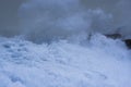 Sea storm waves dramatically crashing and splashing against rocks