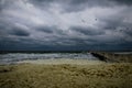 Sea storm at the beach with heavy clouds Royalty Free Stock Photo