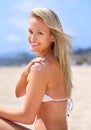 Sea, sun and summer fun. A gorgeous young blonde woman enjoying summer on the beach. Royalty Free Stock Photo