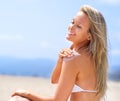 Sea, sun and summer fun. A gorgeous young blonde woman enjoying summer on the beach. Royalty Free Stock Photo