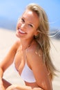 Sea, sun and summer fun. A gorgeous young blonde woman enjoying summer on the beach. Royalty Free Stock Photo