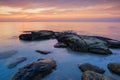Sea sunrise at the Black Sea coast near Ravda, Bulgaria. Rocky sunrise Royalty Free Stock Photo
