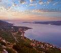 Sea sunset, Croatian islands and Viganj village on seashore
